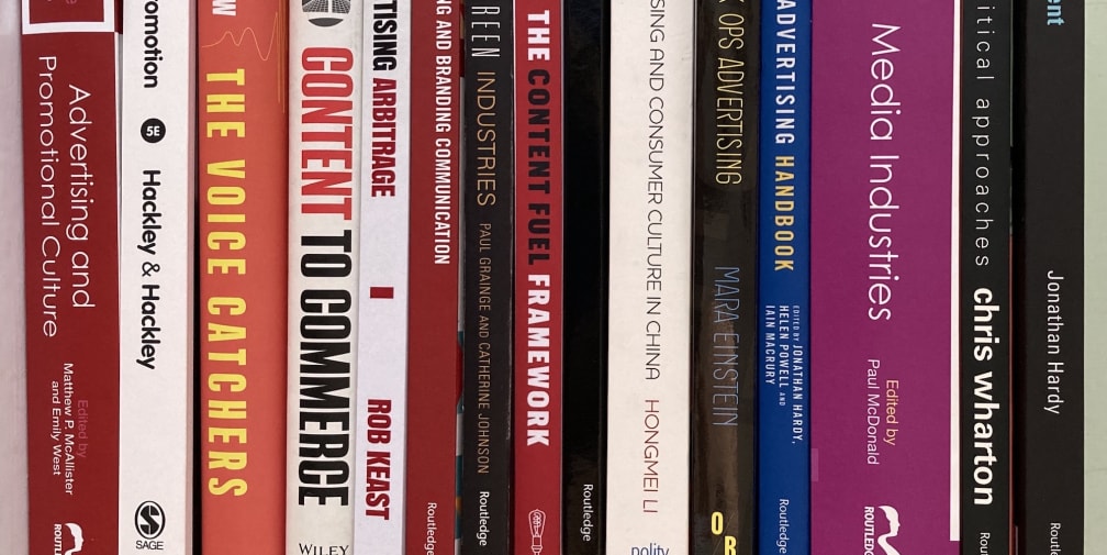 A stack of books related to branding