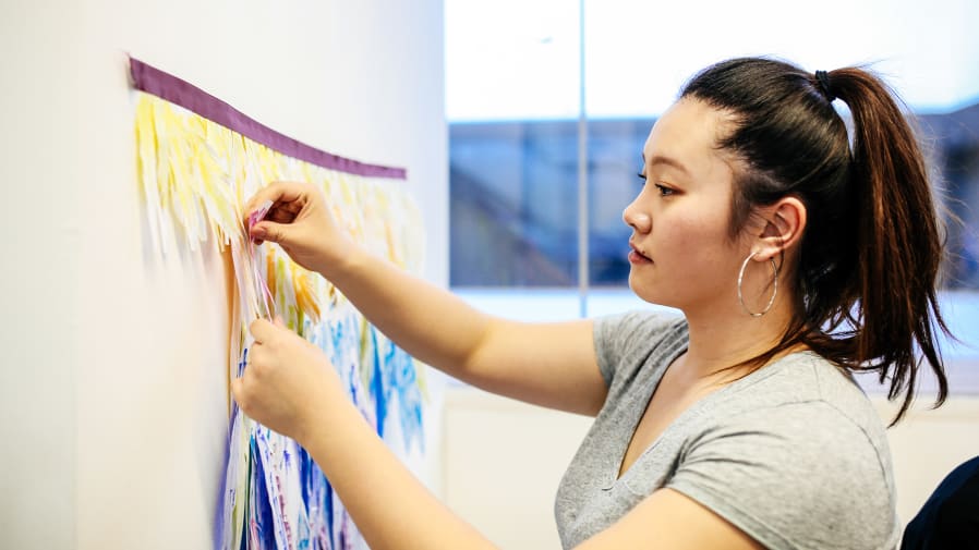 Student making working artwork in the studio
