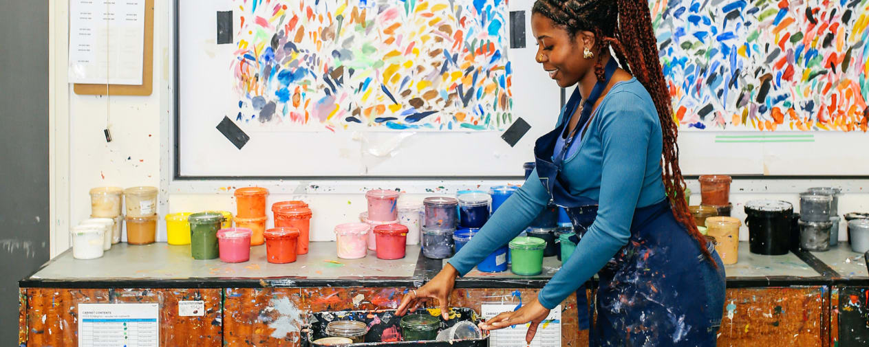 student choosing ink in printing workshop