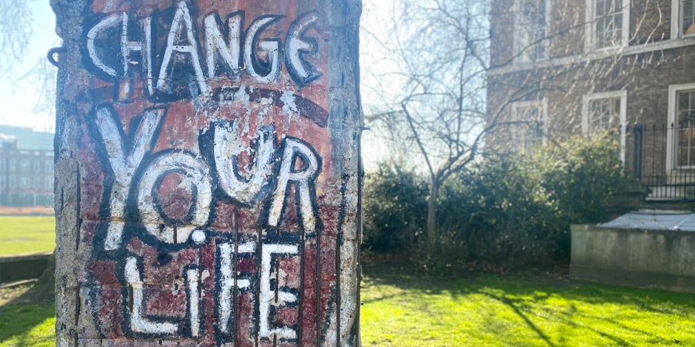 Photo of a tree which has 'Change your life' written on it