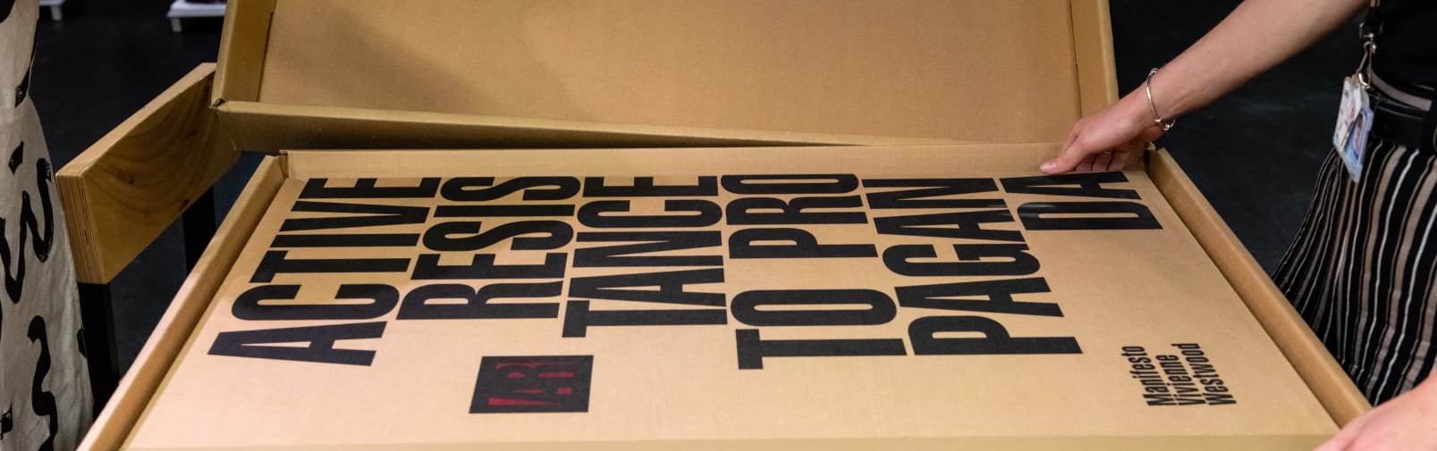 Picture of a very large book, 'Active resistance propaganda' flat on a table. Photo by Ana Blumenkron, 2022