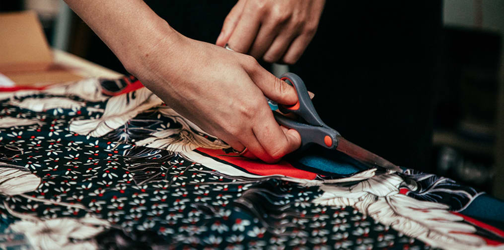Close up of fabric being cut 