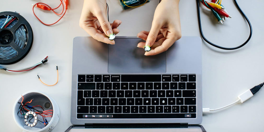 Close up image of someone holding computing equipment