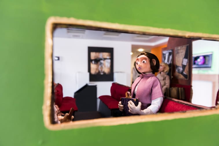 Animation model of a woman sitting in on a train 