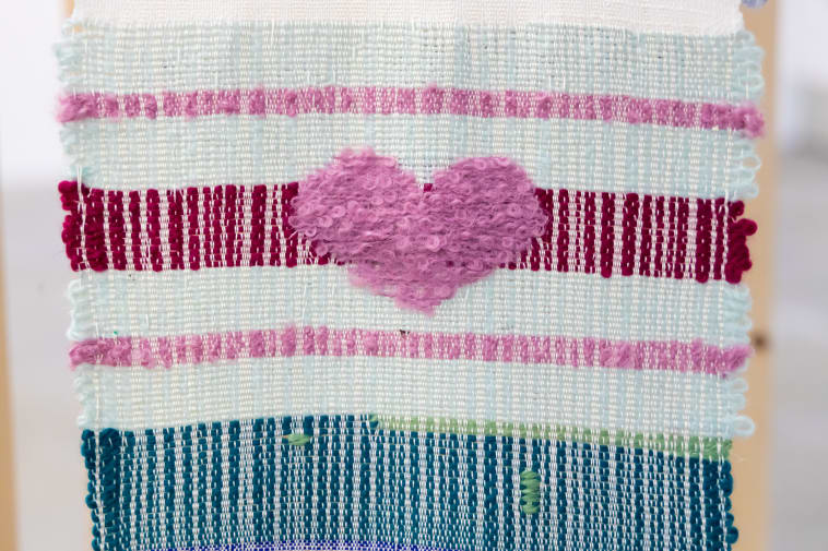 textile design hanging with pink heart embroidery
