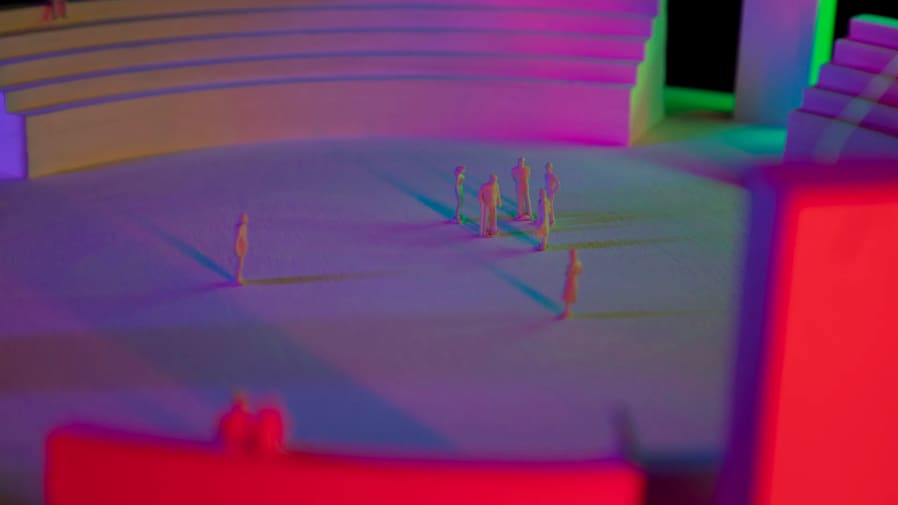 Model of a theatre with multicoloured figures 