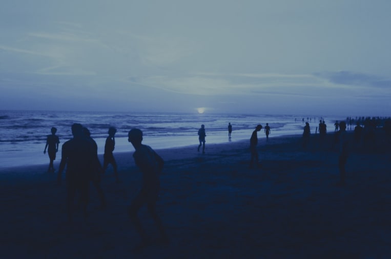 silhouettes on beach