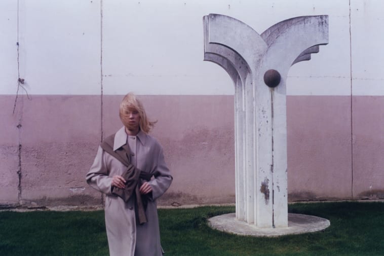 Student standing beside monument in Slovakia.