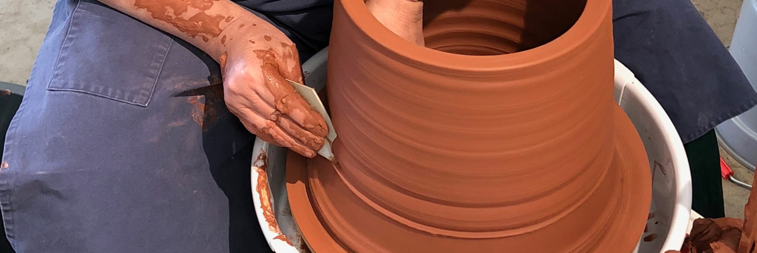 A man in the process of pottery