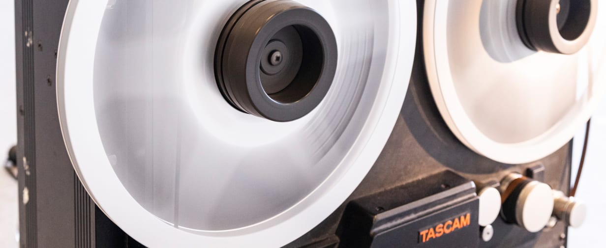 A close up of a Tascam reel to reel tape recorder.