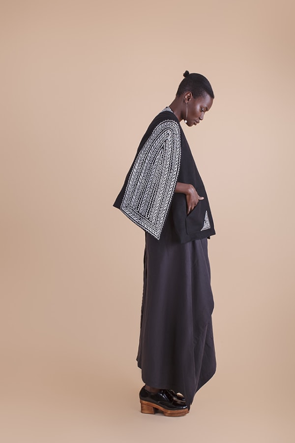 CarlaFernandez_Charracape_slideshow_credit-Magna-Charro-cape,-wool-with-goat-leather-fretwork-from-Chimalhuacan,-Estado-De-Mexico,-acetate-lining,-2017.jpg