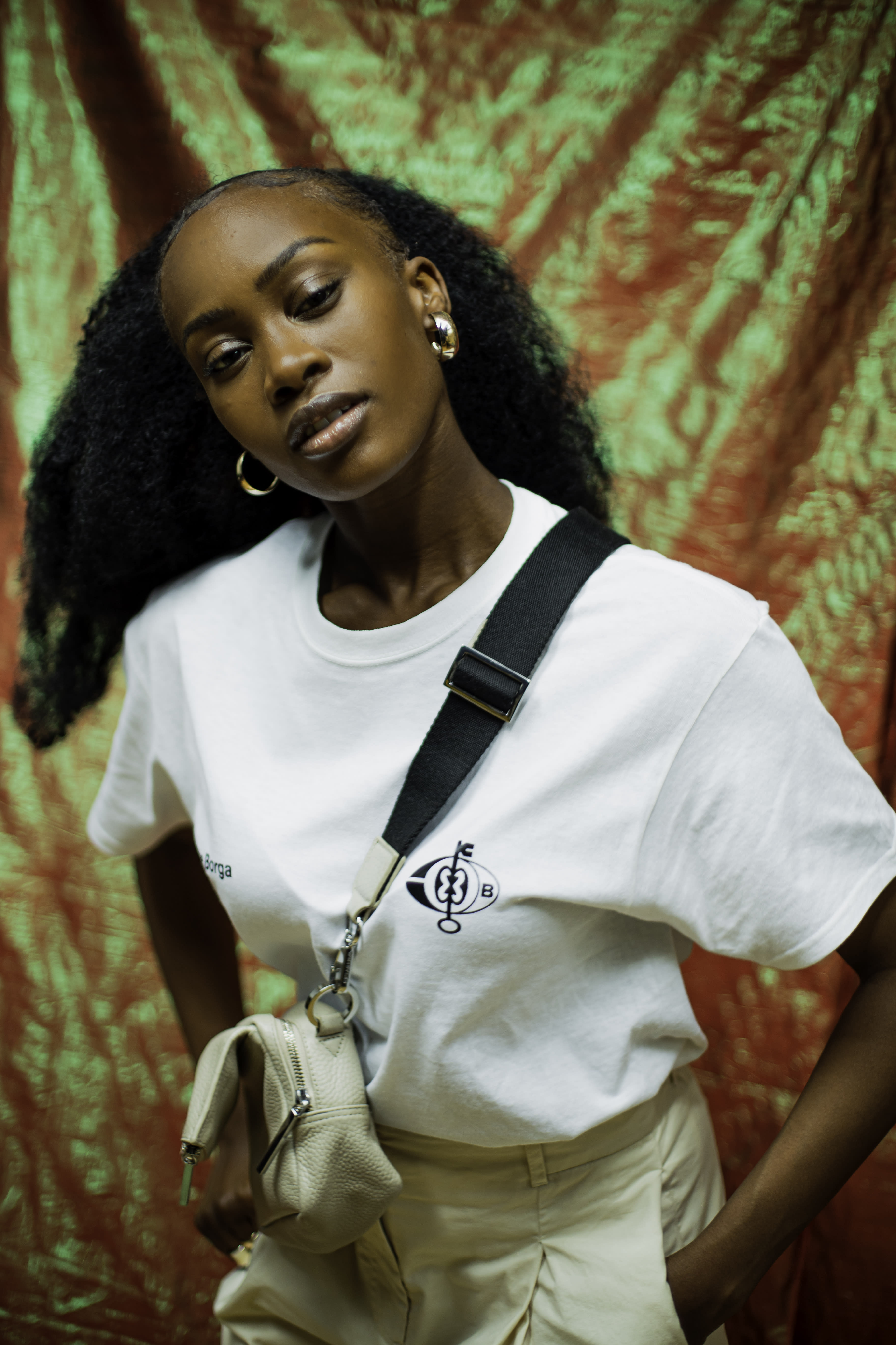 Girl in photoshoot with cross body bag