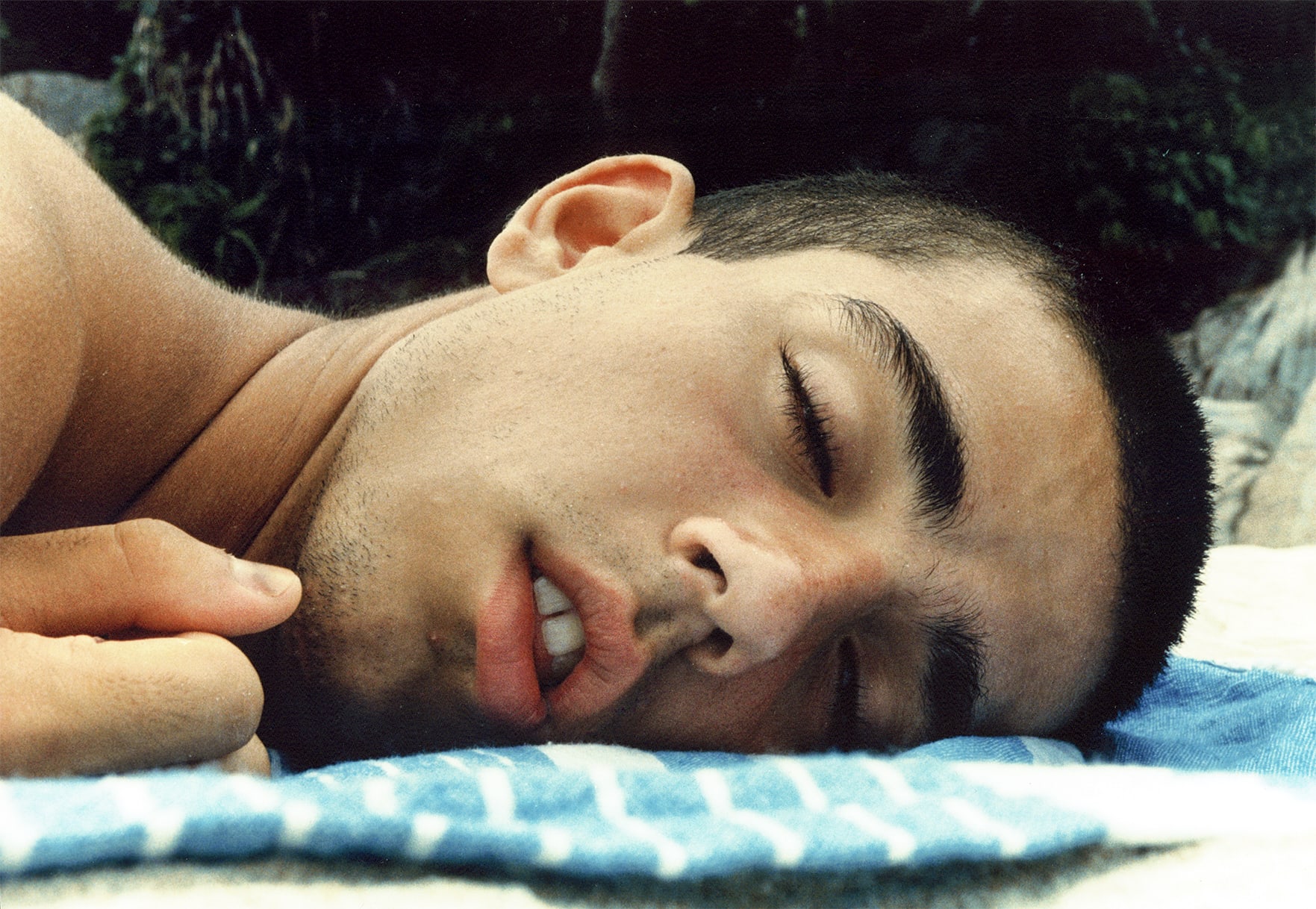 man laying on floor asleep