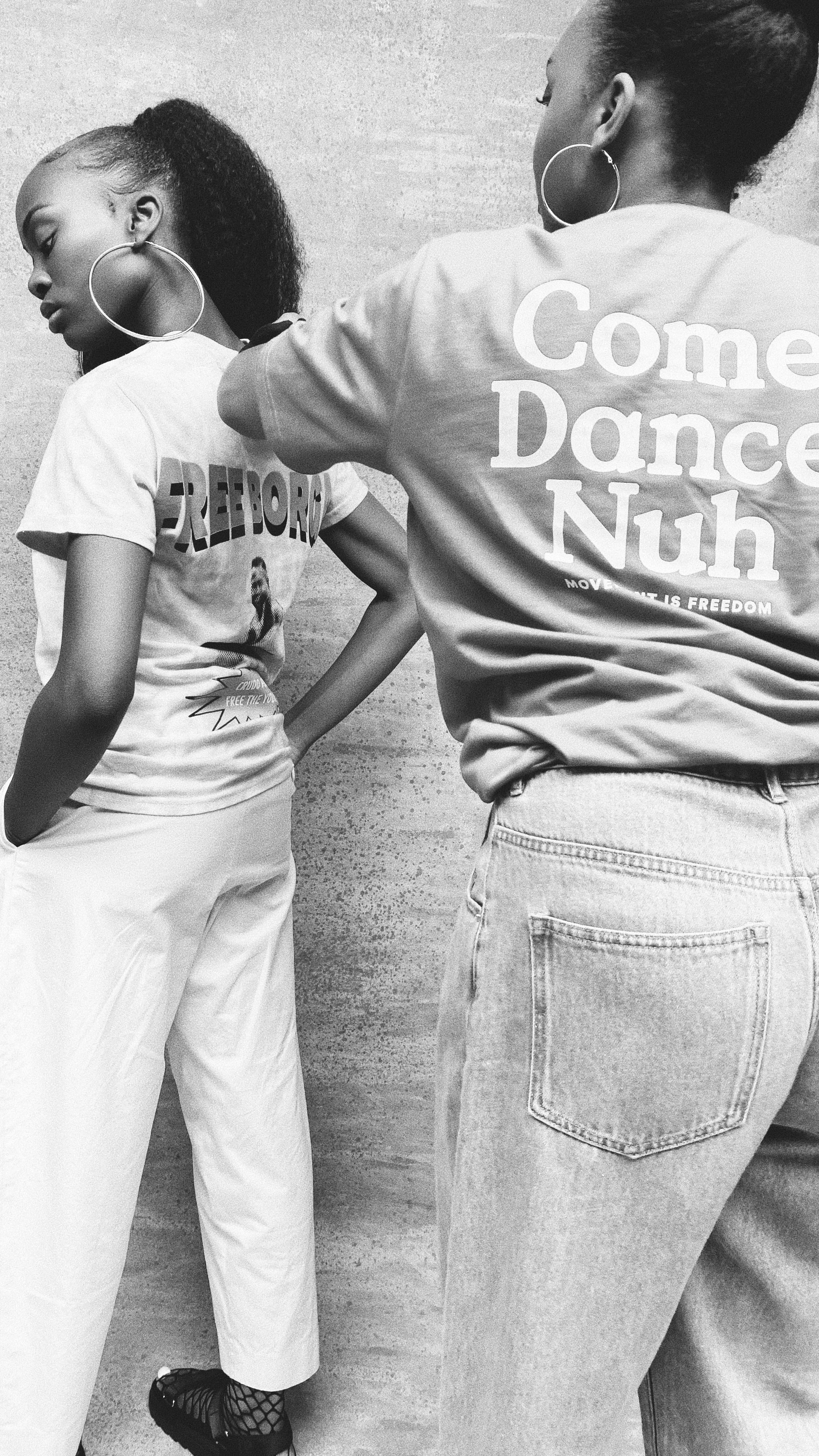 Black and white image of 2 girls in a photoshoot