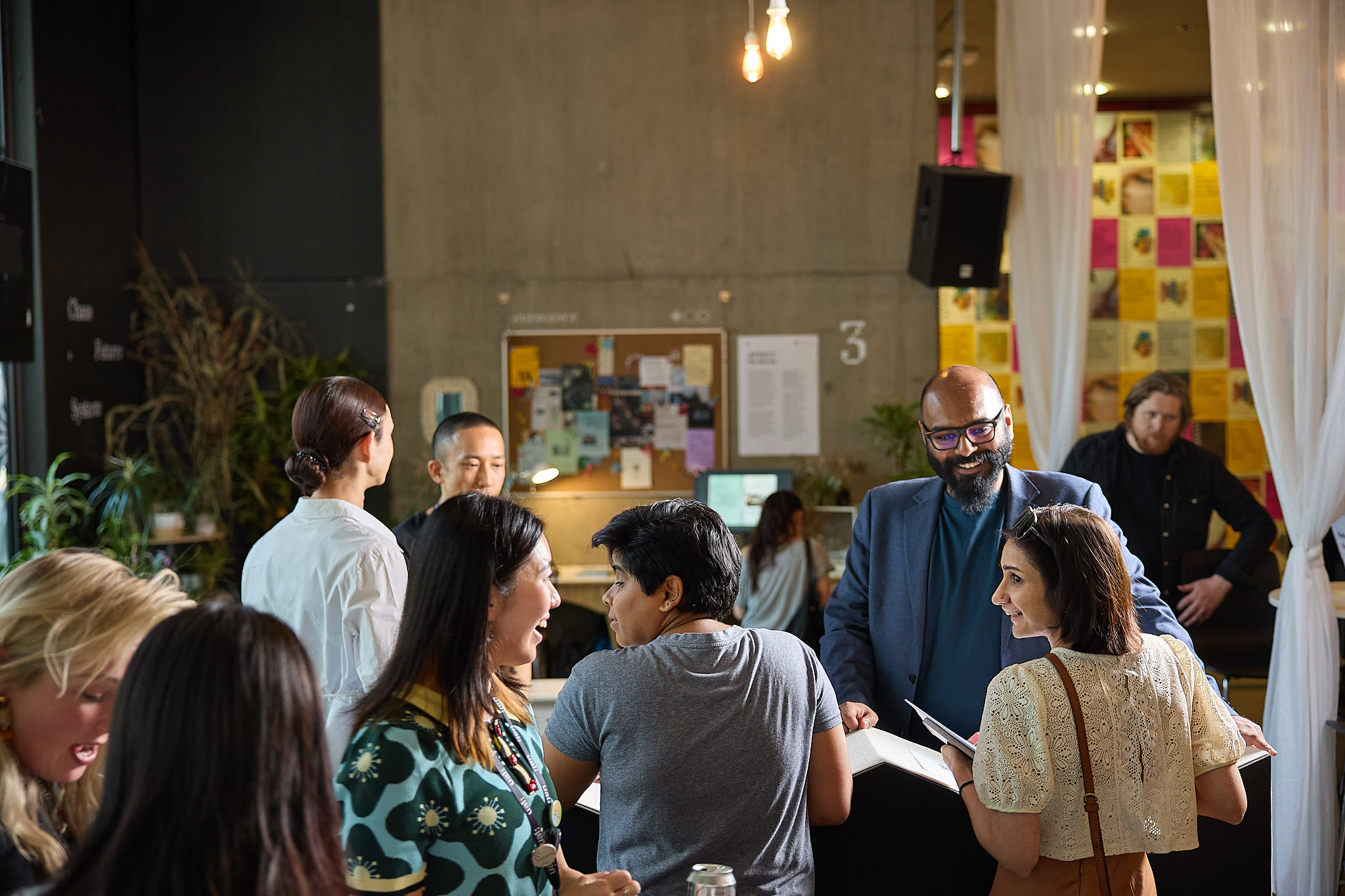 People interacting with one another at an exhibition
