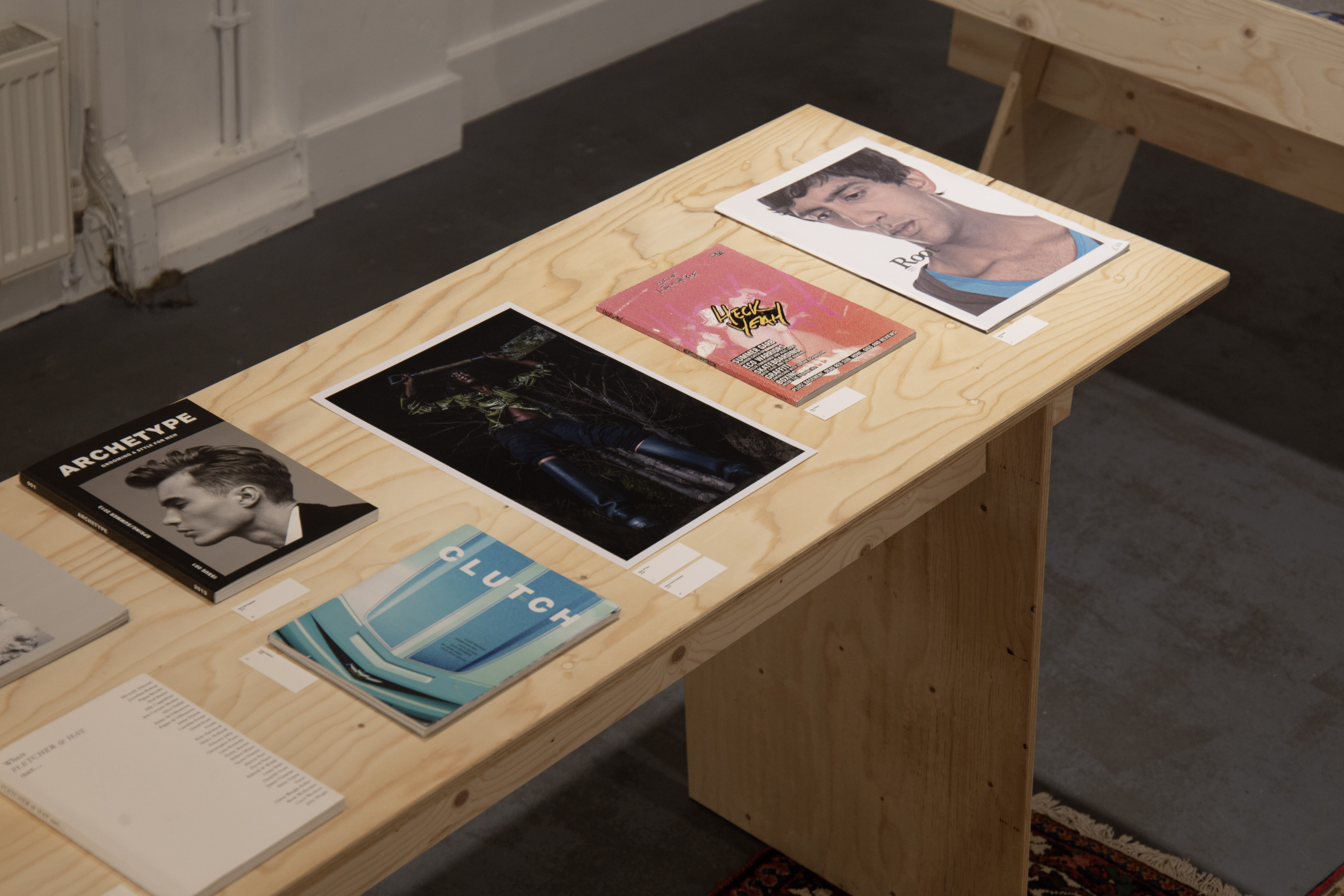 Wooden vitrines with magazines.