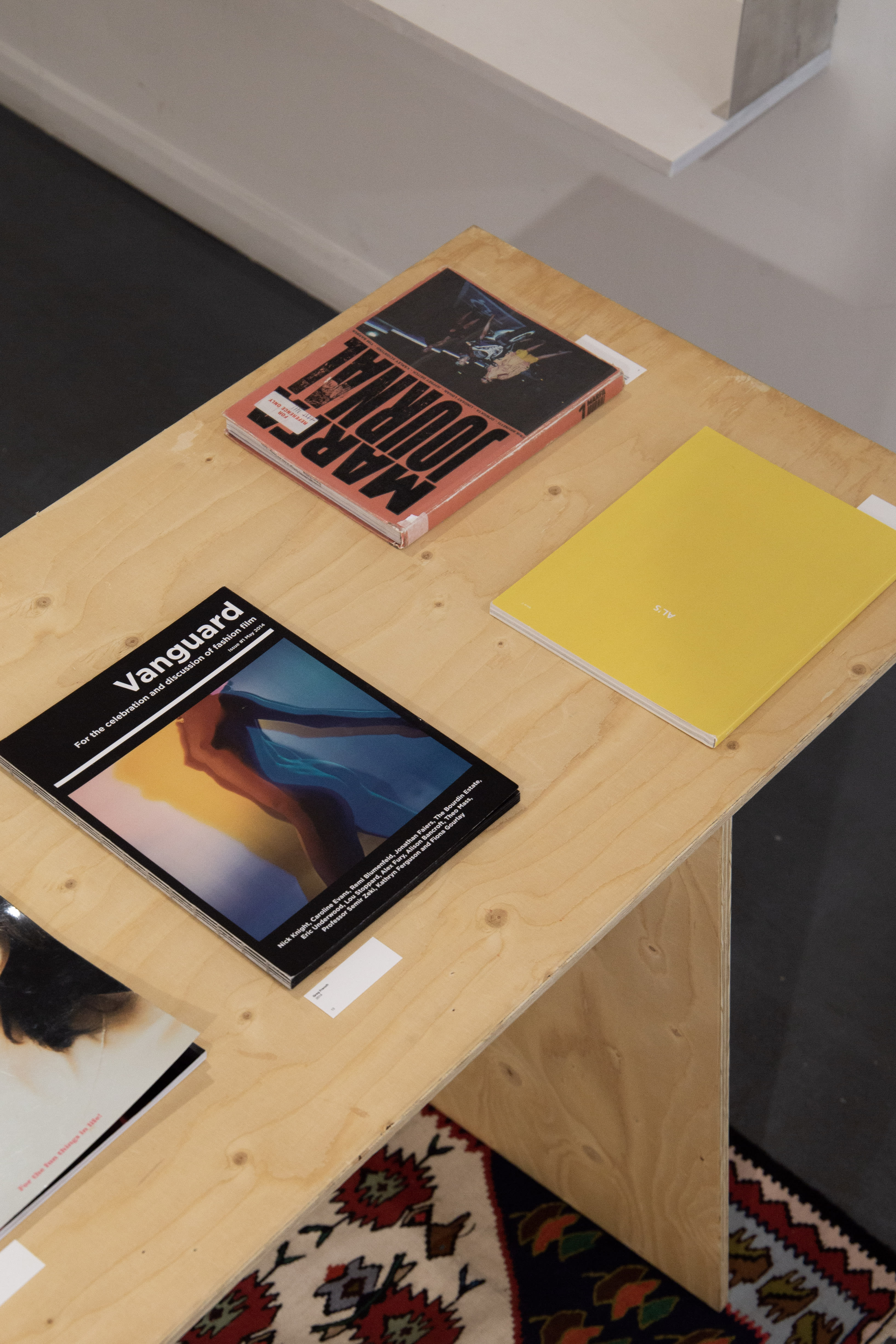 Wooden vitrines with magazines.