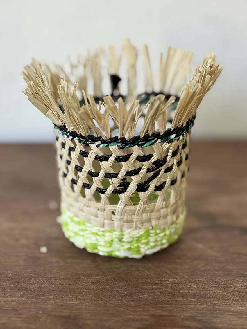 Plant pot woven from jipi japa and waste plastic