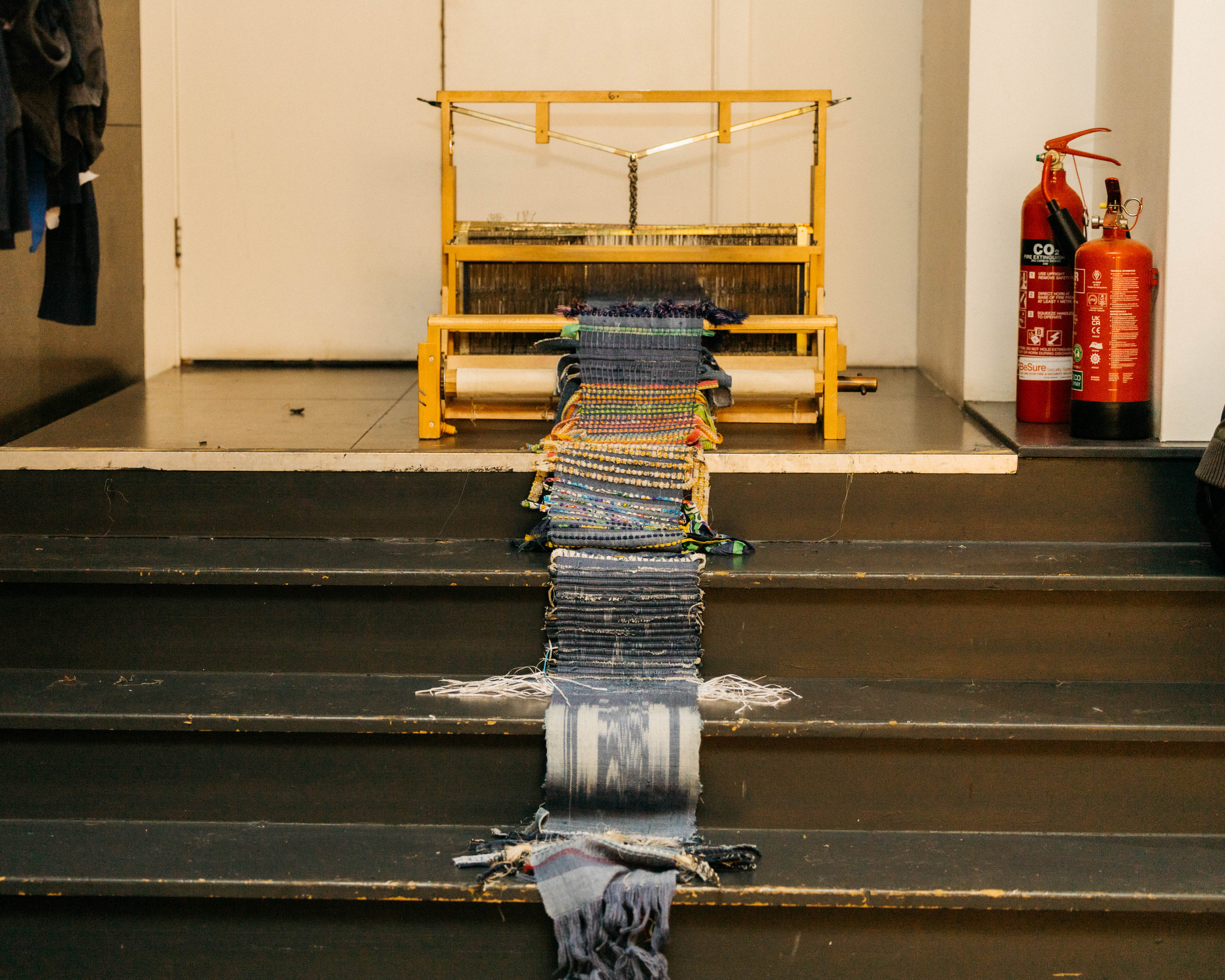 A piece of woven art made of jean fabric