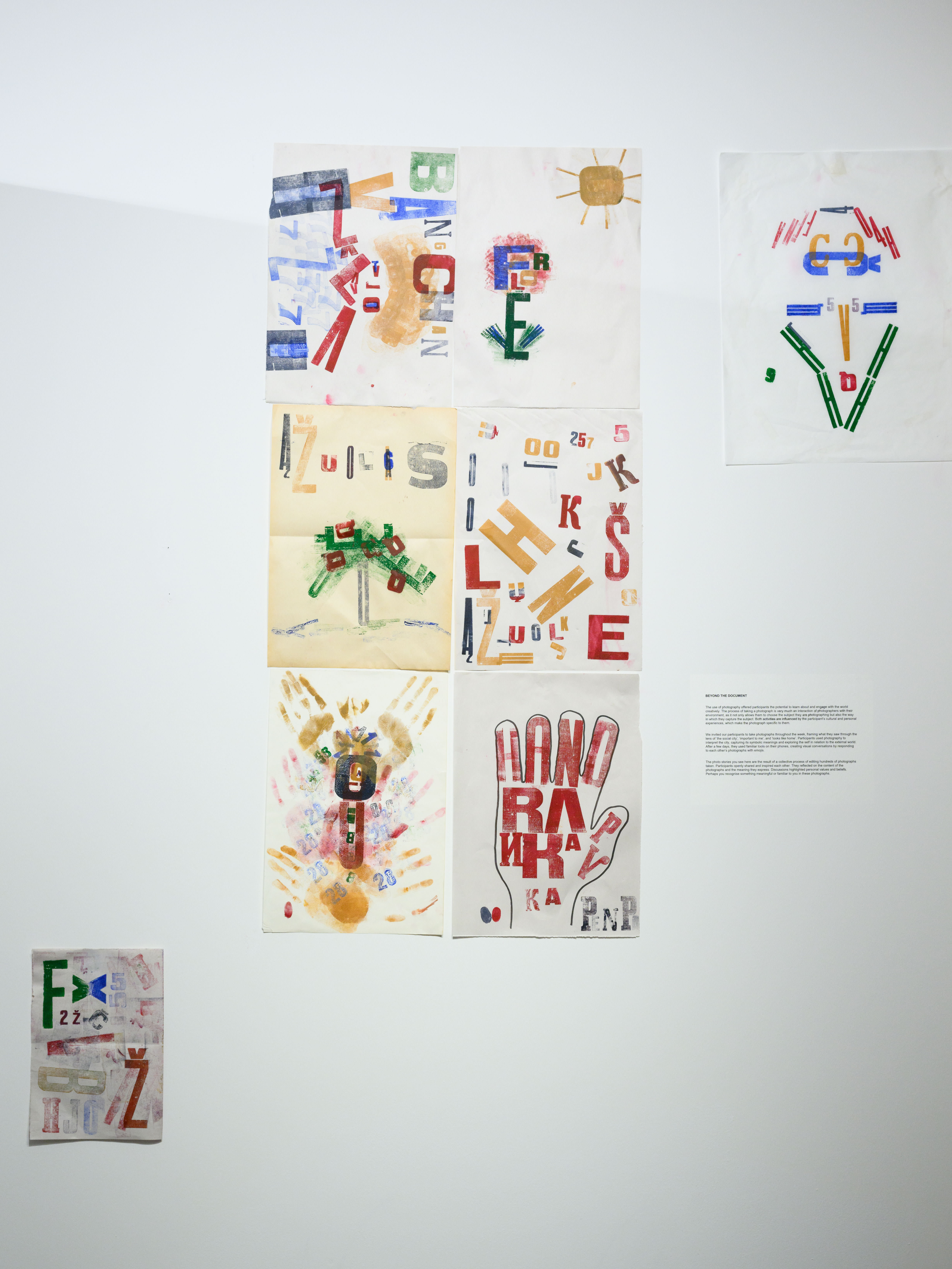 A4 print artworks on a white wall in the exhibition