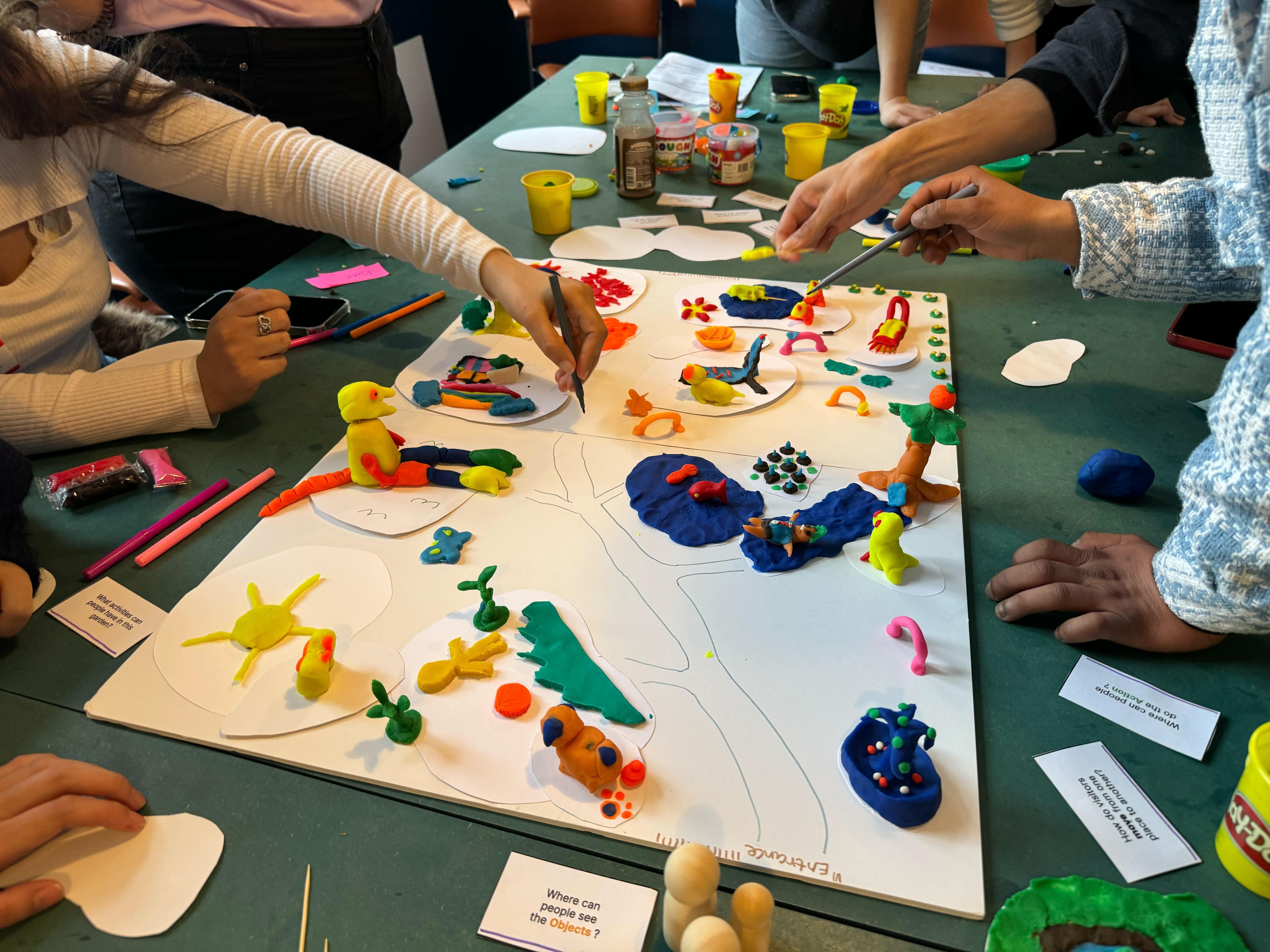 Table with plastacene objects as part of a student workshop.