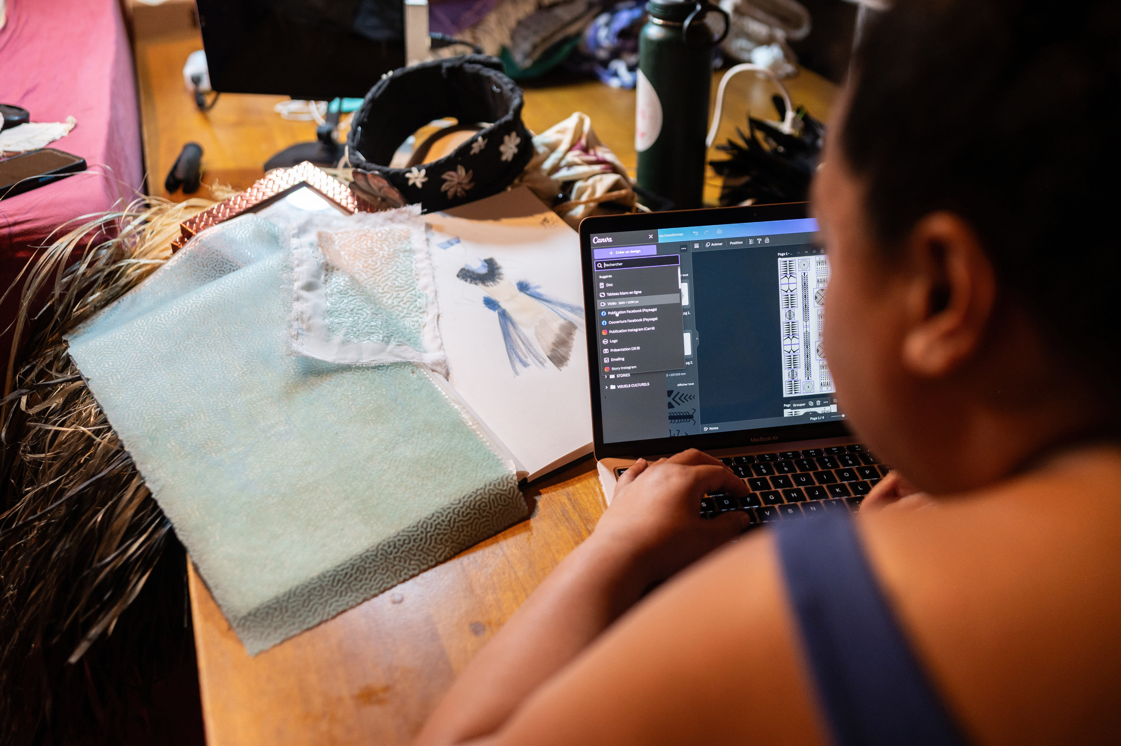 Hinatea Colombani designing symbols for the material.