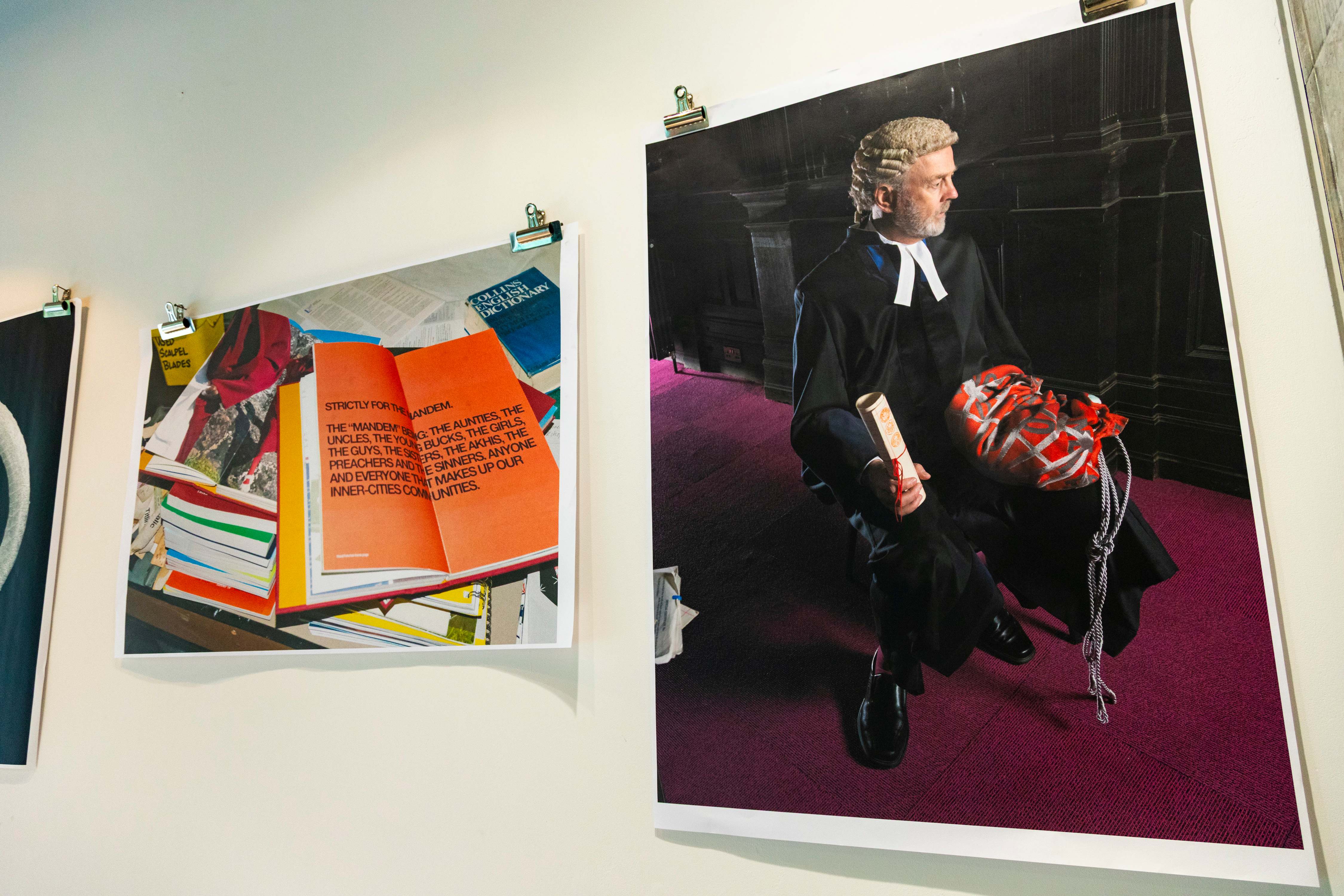 Hanging prints showing project shots and closeups of the work in the display plus accompanying text..