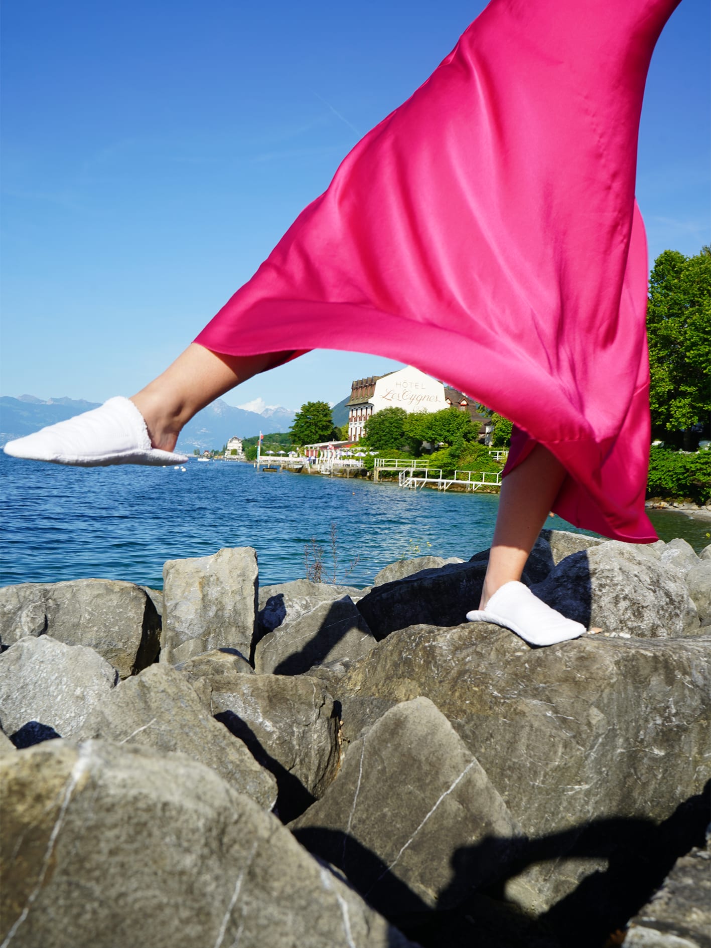 An image of a person wearing white hotel slippers