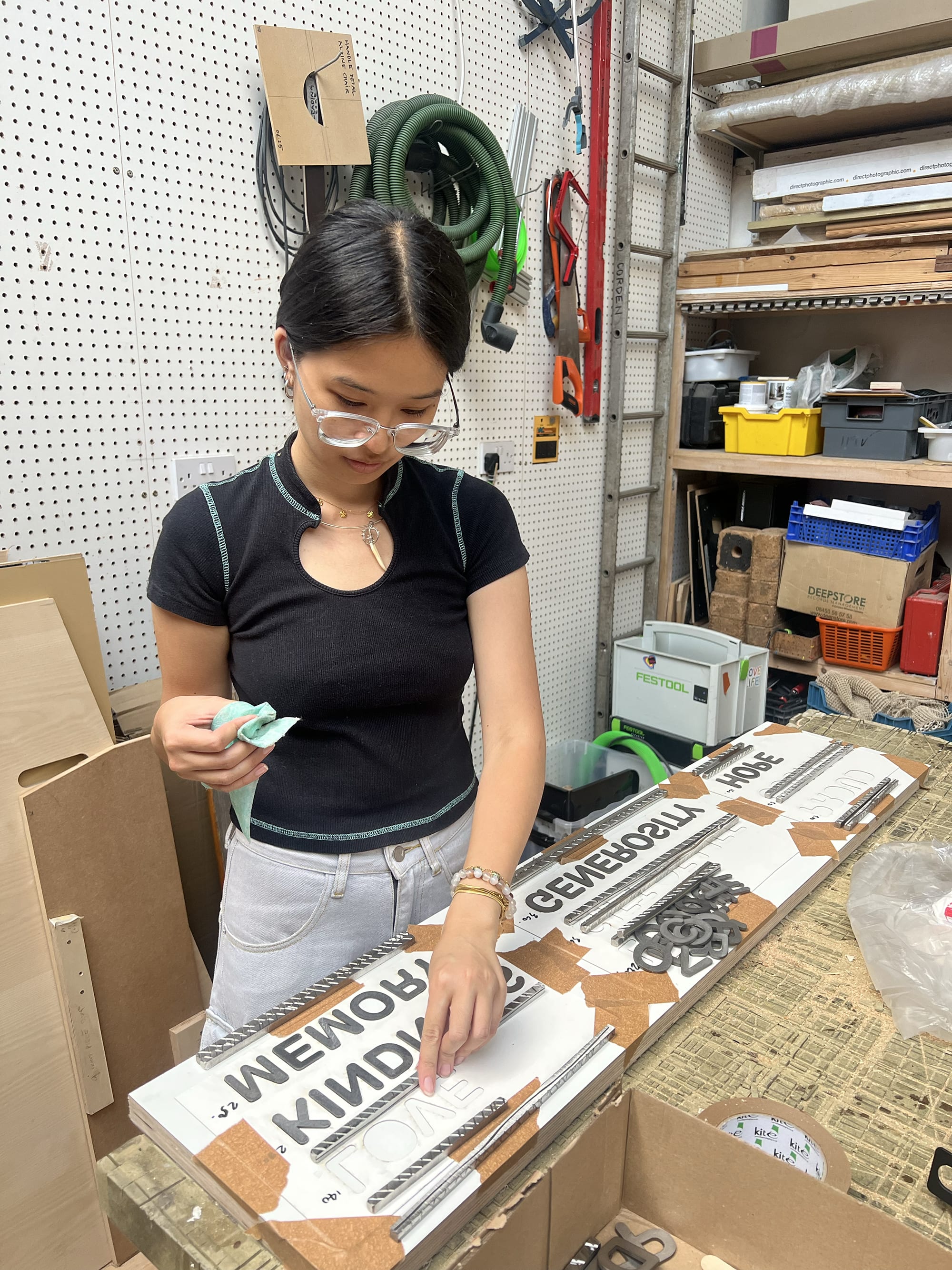 Girl working on the organ memorial design in the Camberwell College of Arts workshop