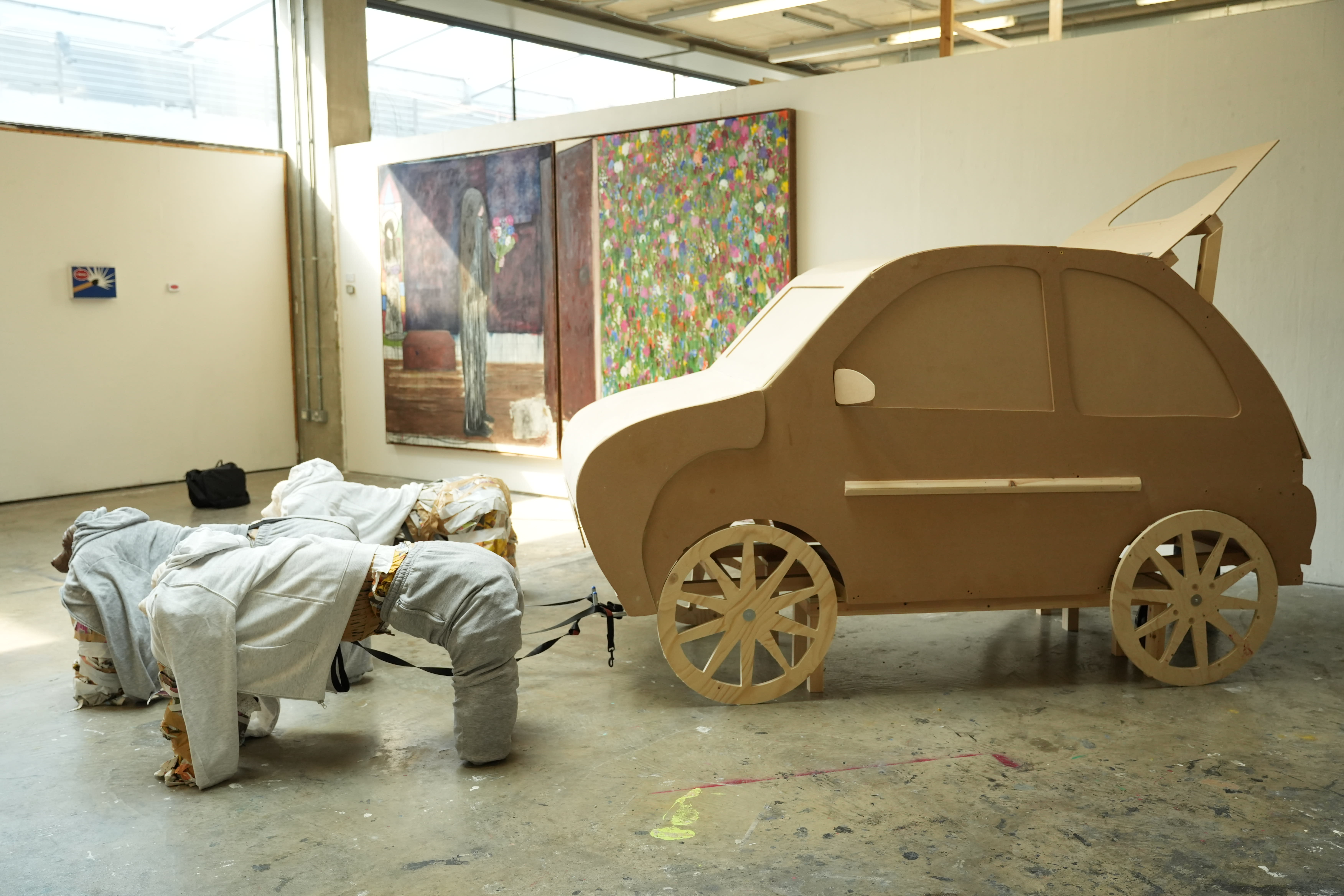 An art installation made with cardboard resembling cars and dogs