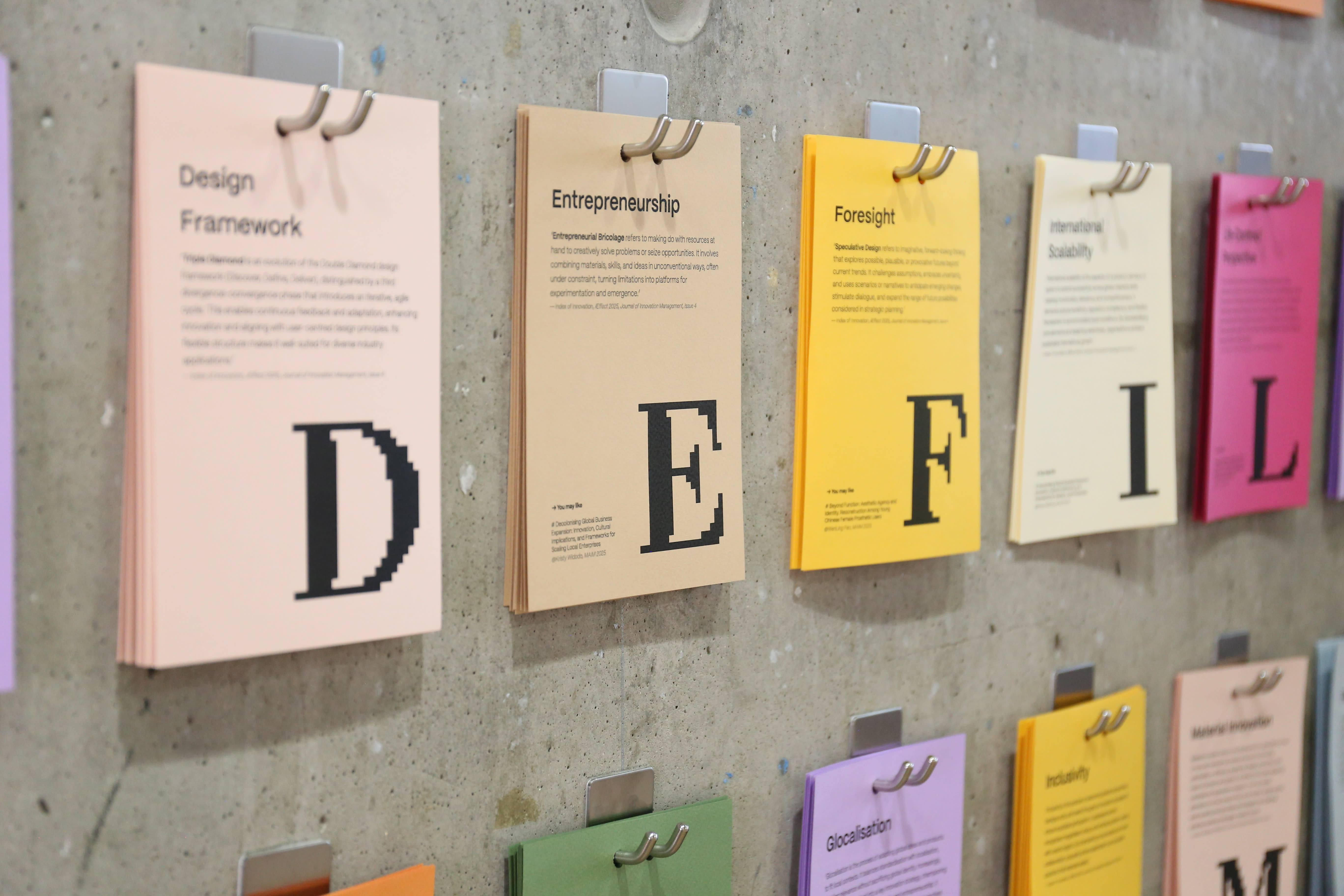 Coloured paper hanging on a wall 