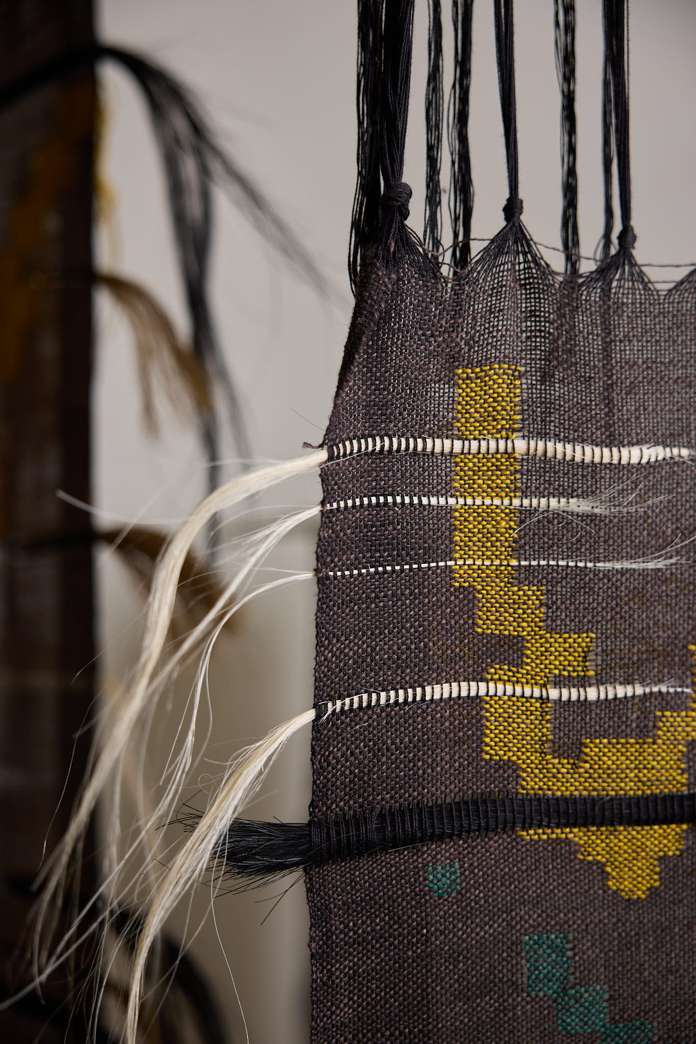 A close up image of woven tapestry