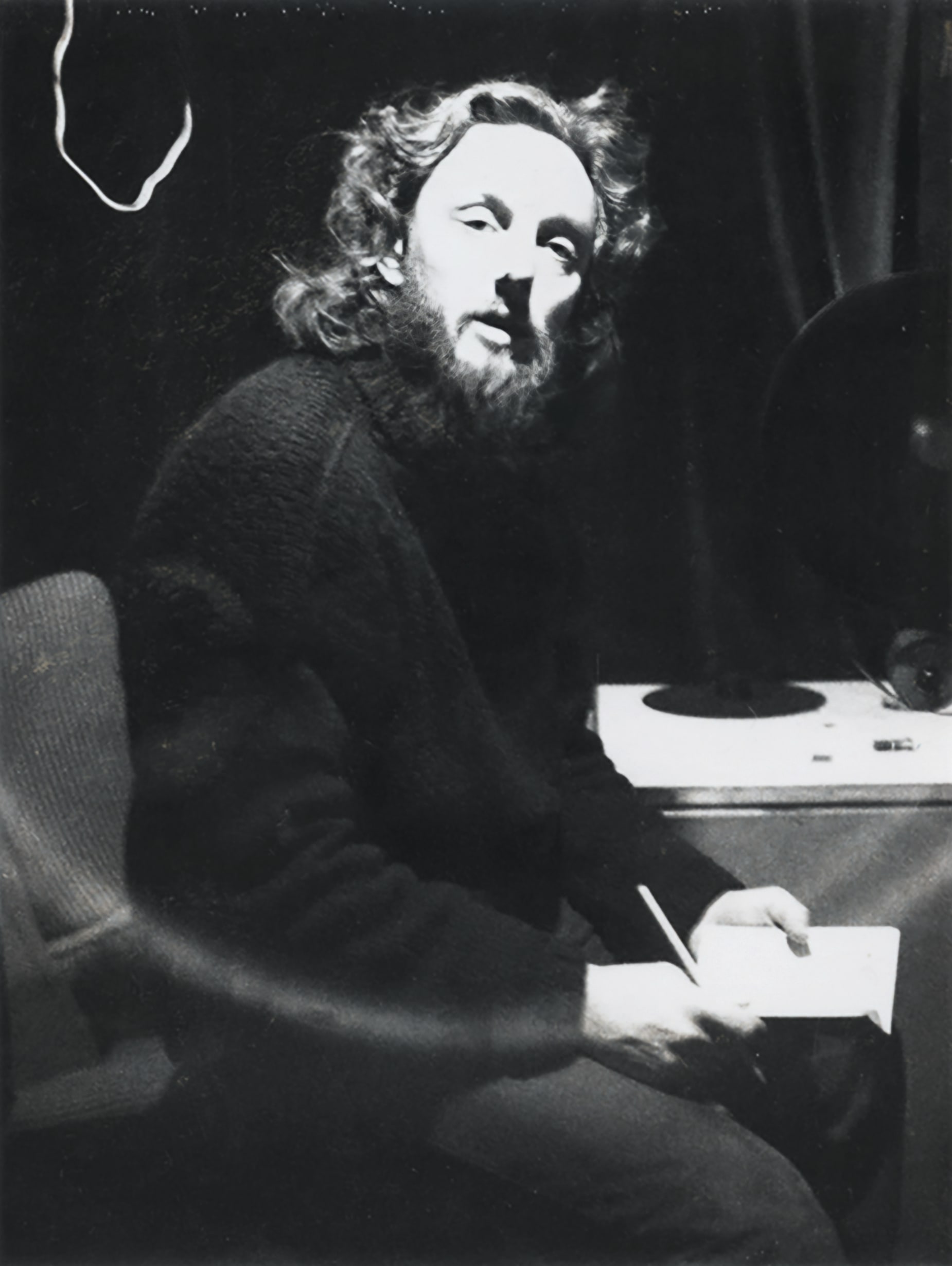 A black and white full body portrait photo of Malcolm