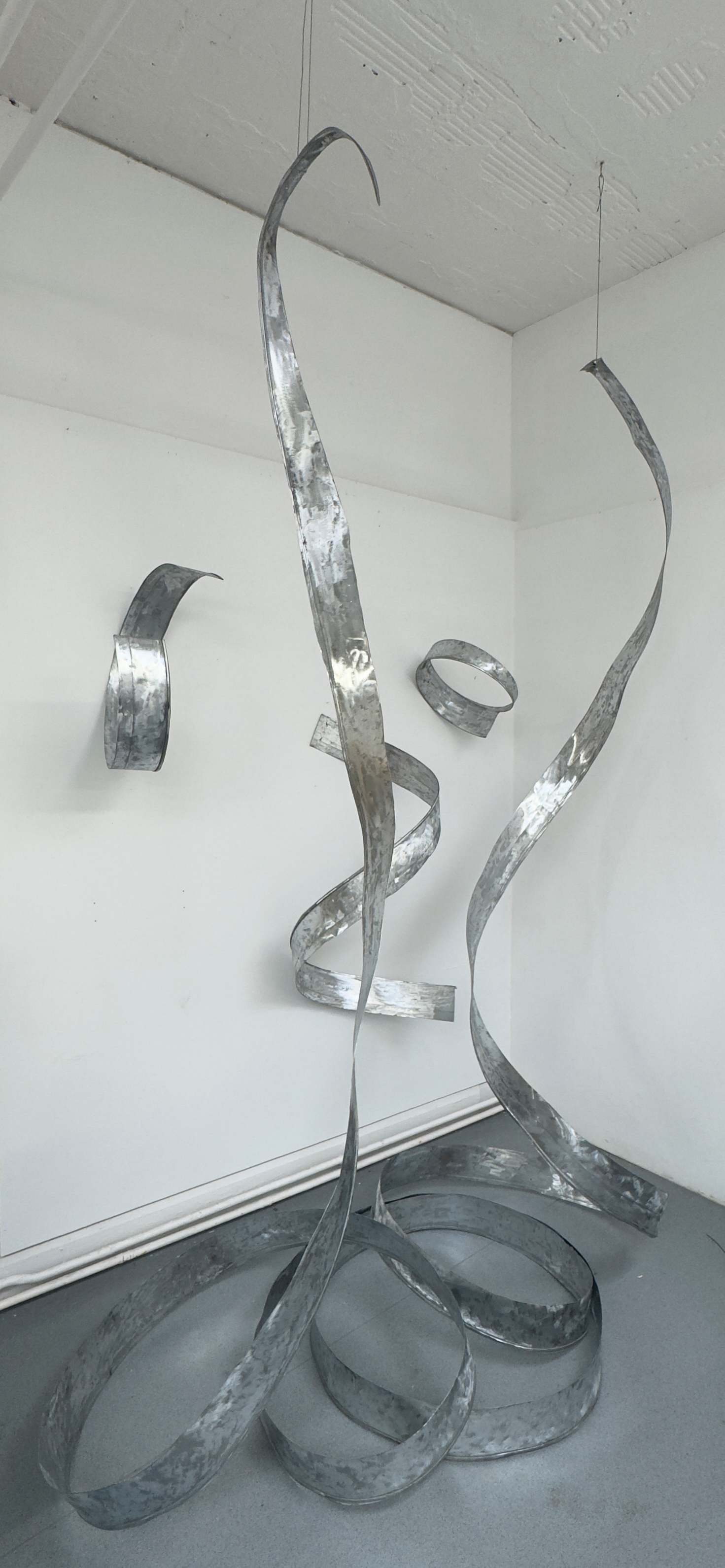 An image of a spiral steel work of art 