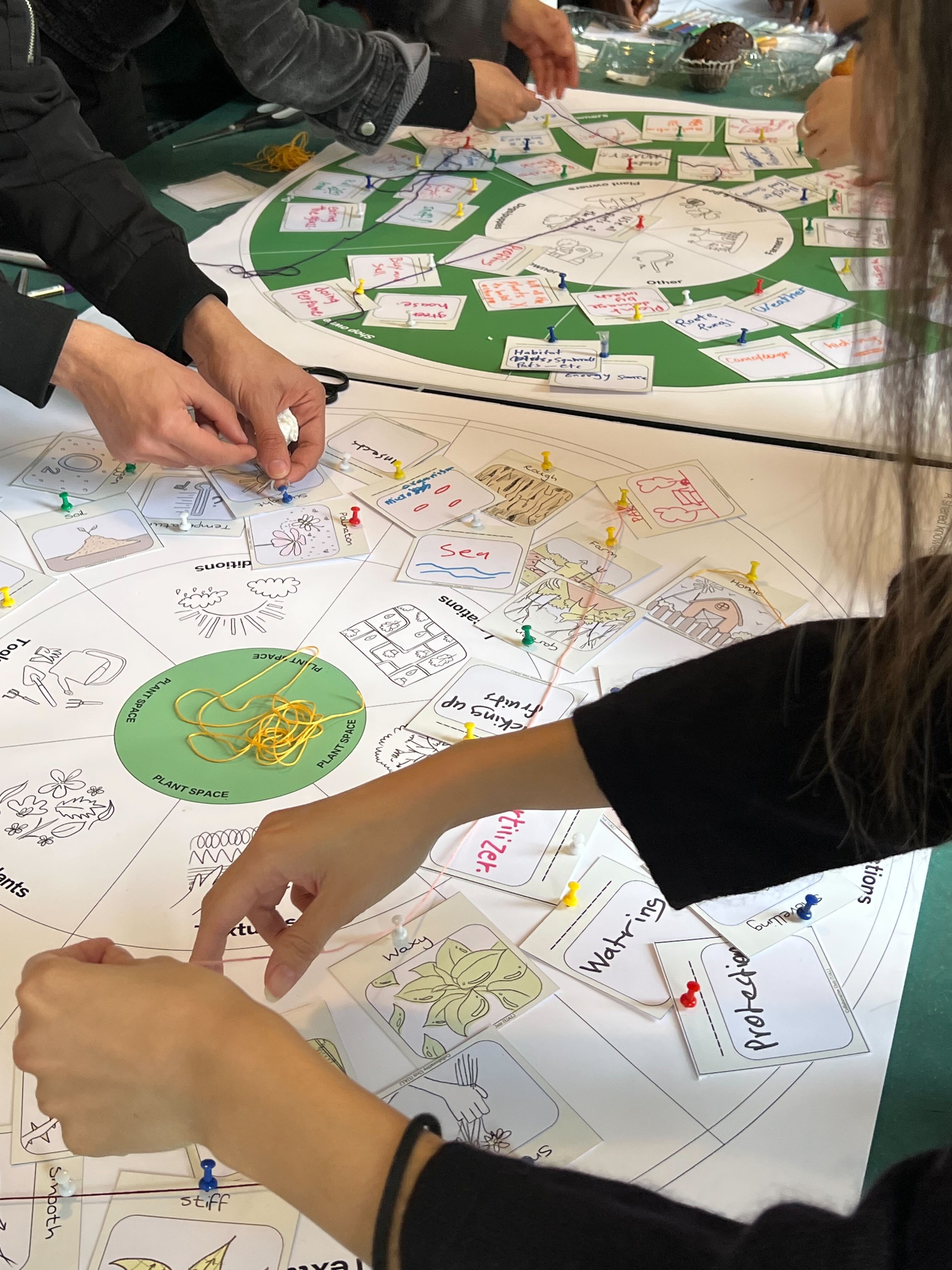 Workshop table showing pen-based designs.