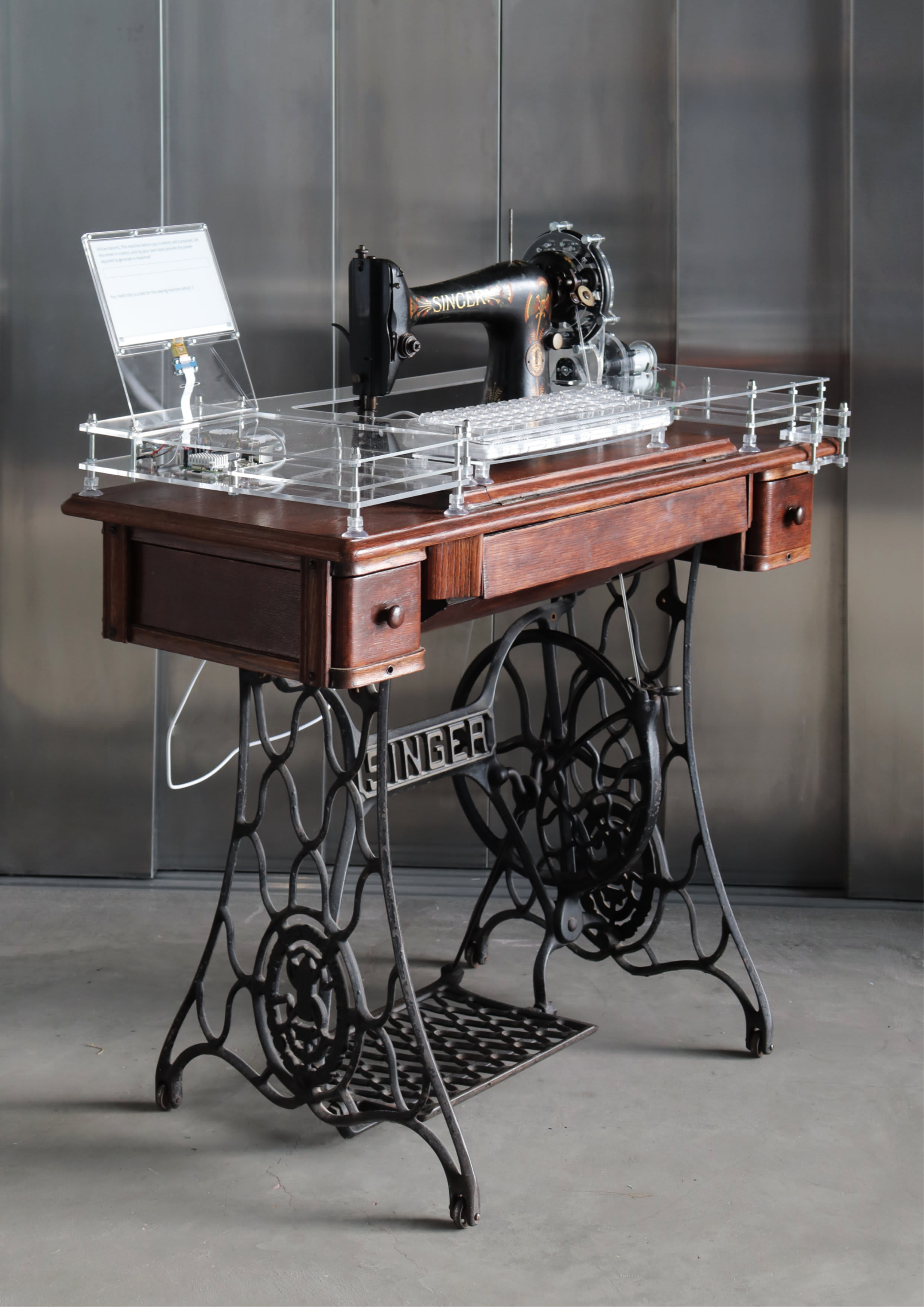 Sewing machine with an attached typewriter. 