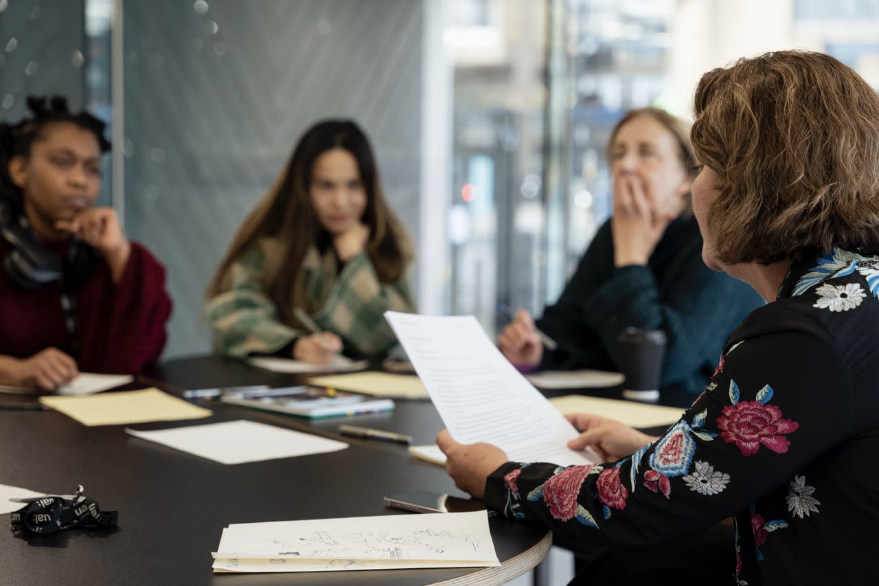 A table of students talking. 