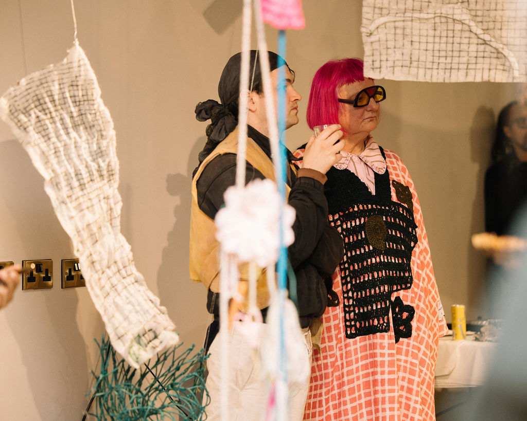 Two people at an art showcasing