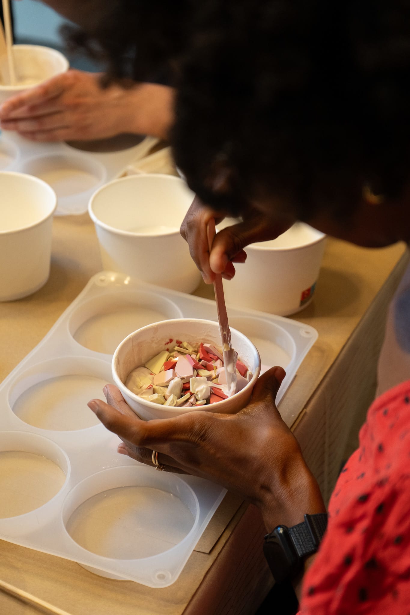 This is a photo of a person mixing ceramics during a Terrazzo Workshop