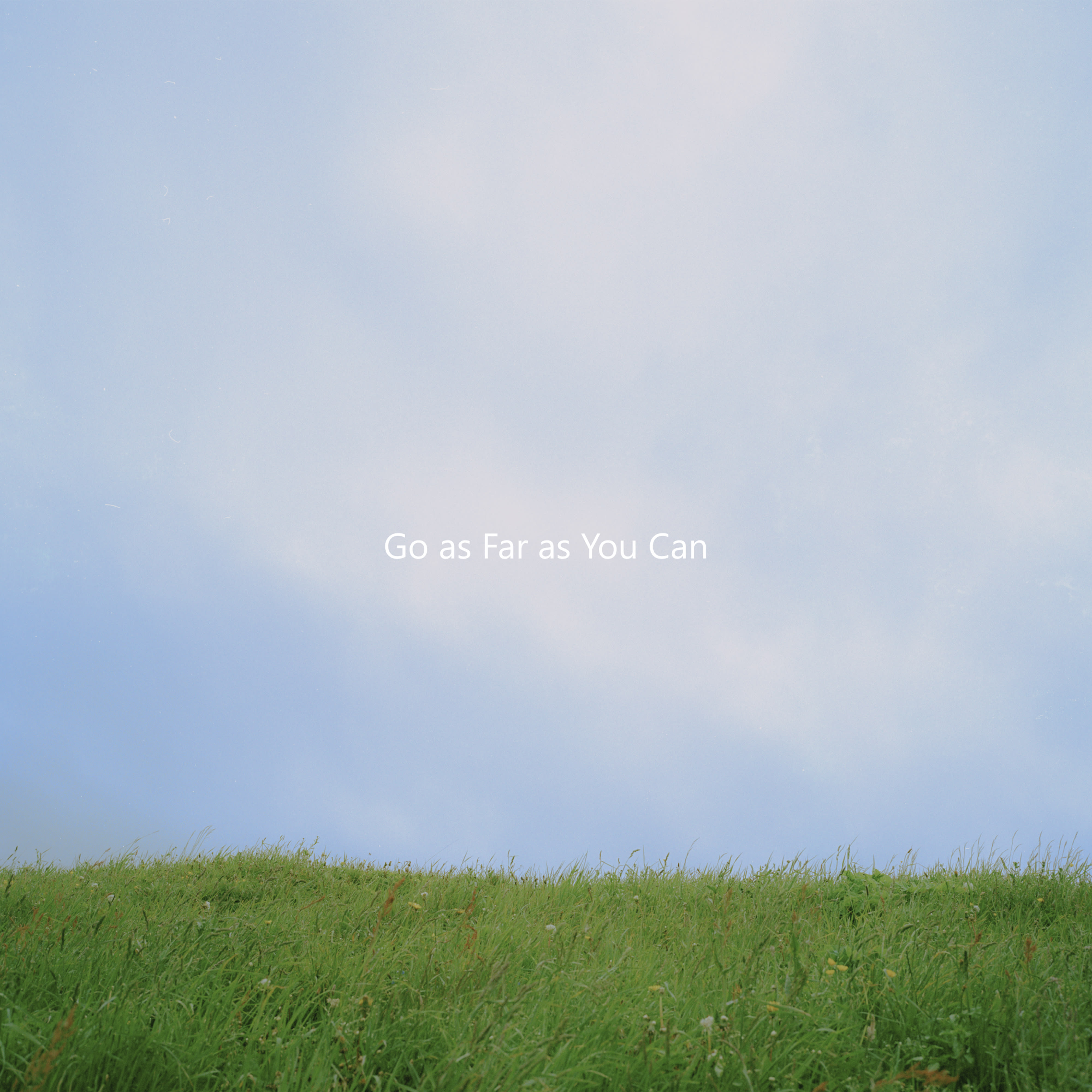 Photo of a blue sky and green grass