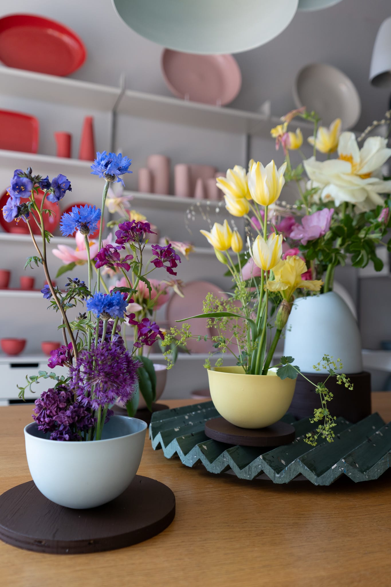 This is a picture of colourful flowers in Mud Australia ceramics as part of the display created by the LCC students for London Craft Week