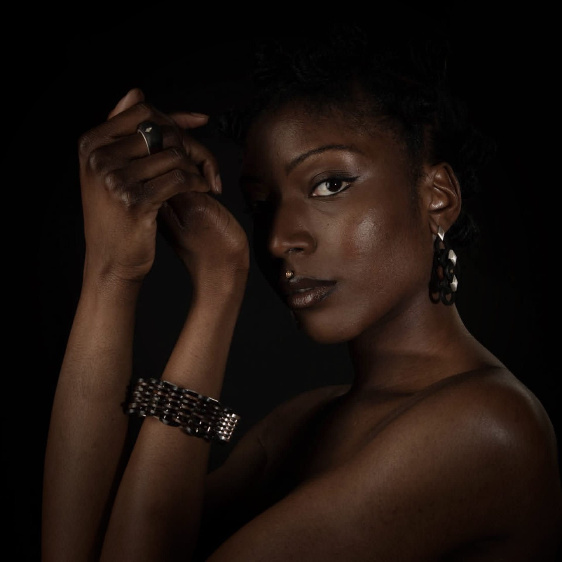 A model with arms upstretched wears the Palms collection