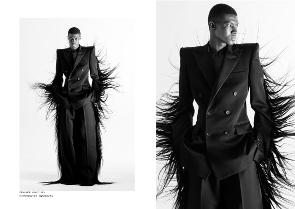 Model wearing tailored suit with wispy hair attached on outer arms and legs of garment pieces 