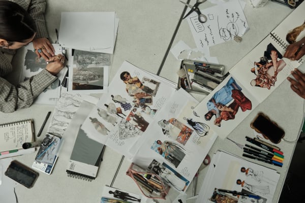 student working on collage of images