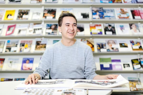 Student laughing in library
