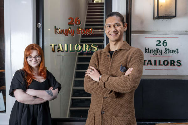 Two people smiling at camera