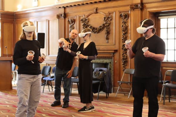 Group of people in a room using virtual reality headsets