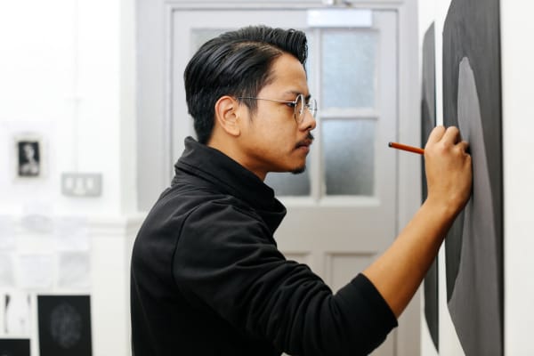 Student drawing in the studio