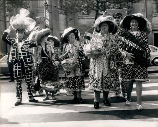 Photo Shows Some of the Pearlies arriving with their Harvest Festival gifts of fruits