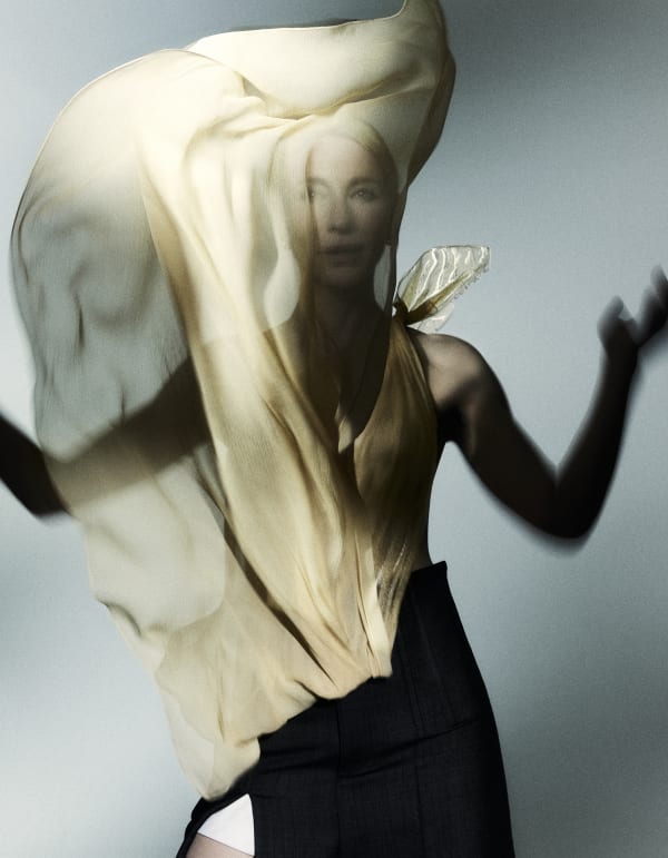 Fashion portrait of actress Cate Blanchett wearing a big cream veil.